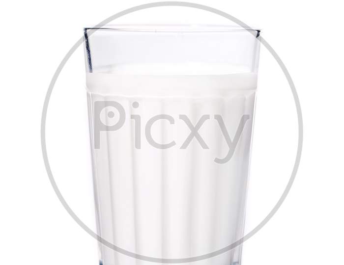 Faceted Glass With Milk. Isolated On A White Background.