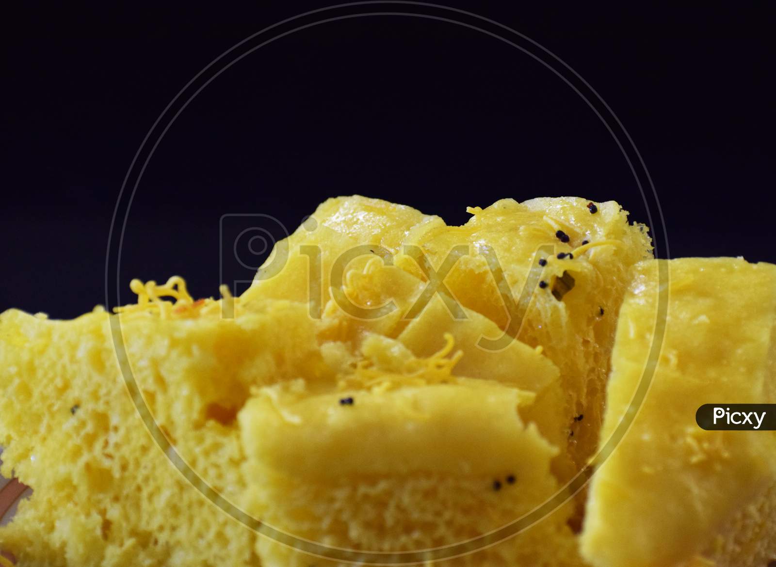 Khaman in black background front and close view