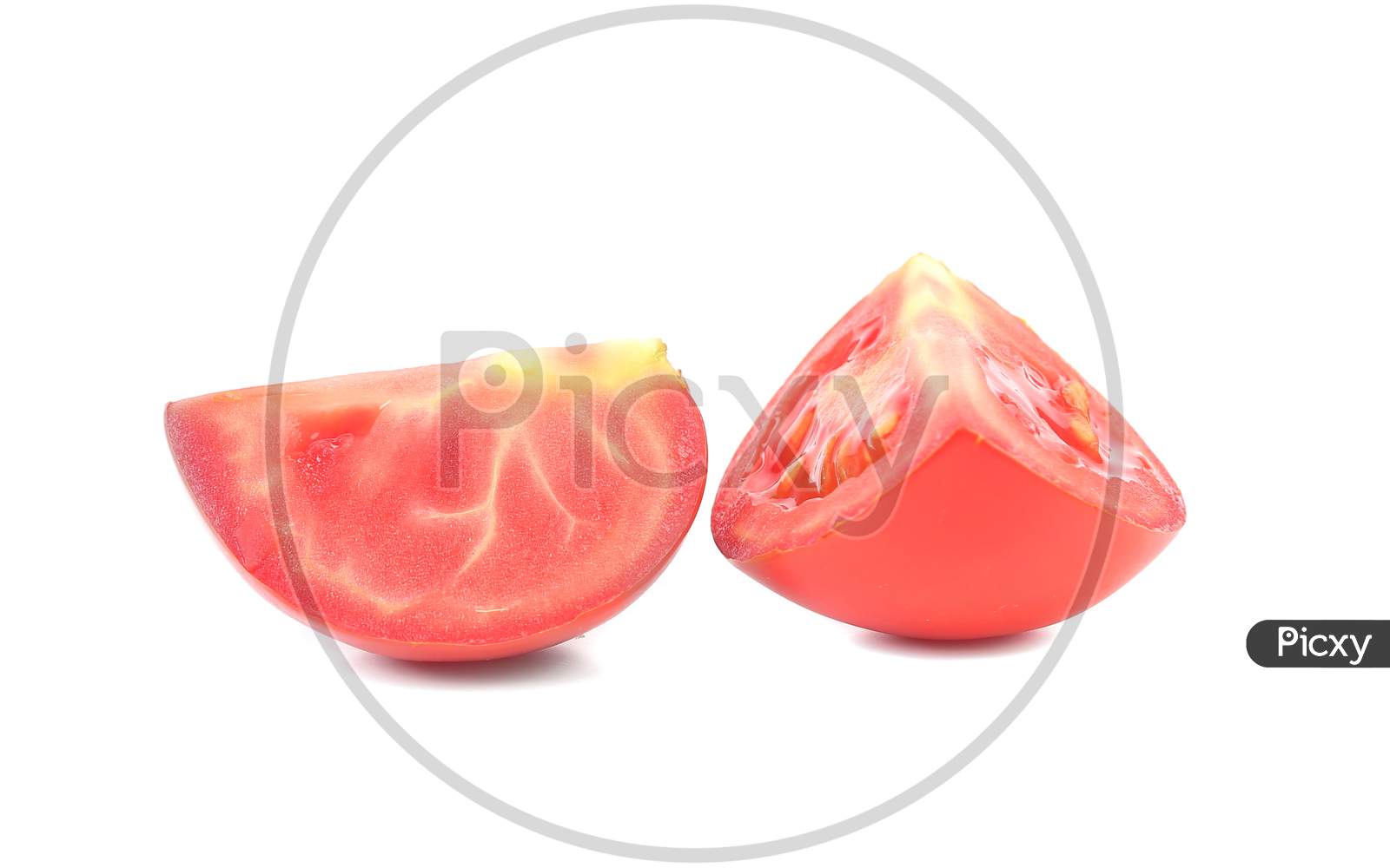 Two Sedments Of Fresh Tomato.  Isolated On White Background
