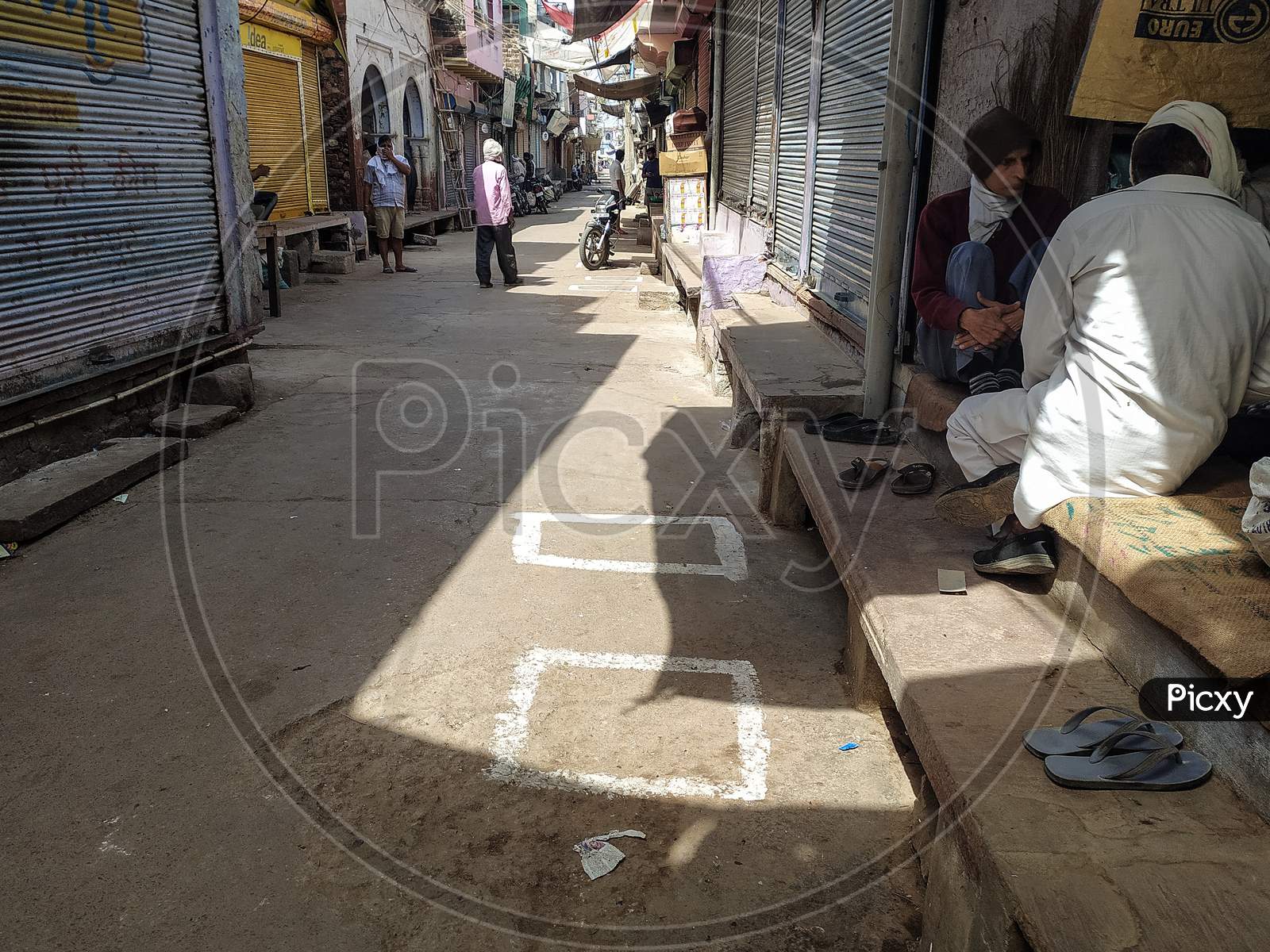 Boxes made on ground outside a shop to ensure social distancing while shopping amid corona virus covid 19 outbreak in India