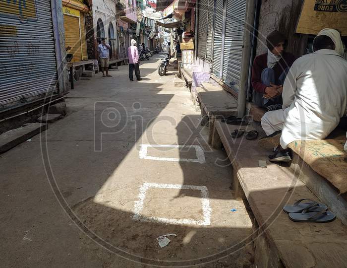 Boxes made on ground outside a shop to ensure social distancing while shopping amid corona virus covid 19 outbreak in India