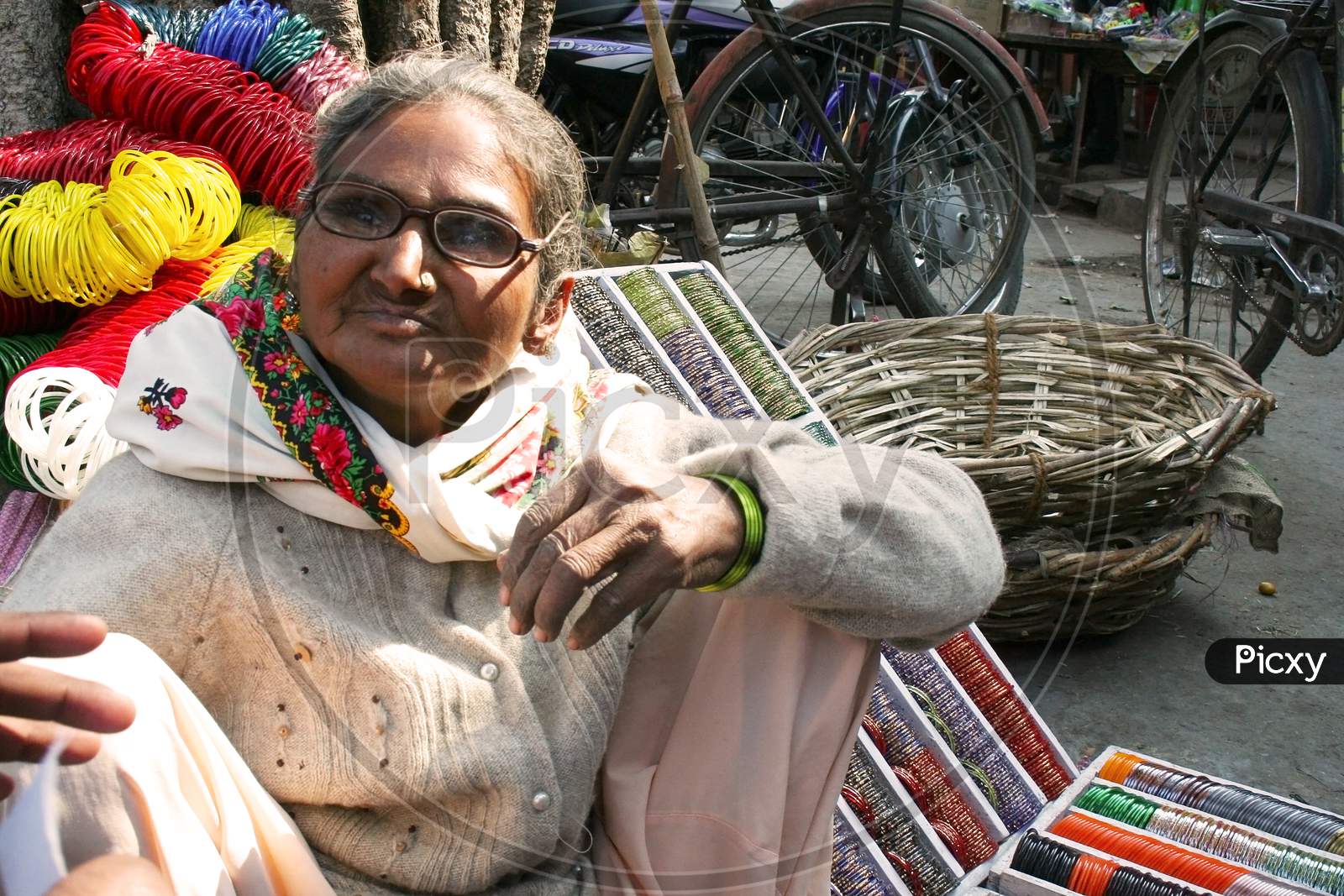 Elderly woman selling bangles at street of Jaipur, rajasthan