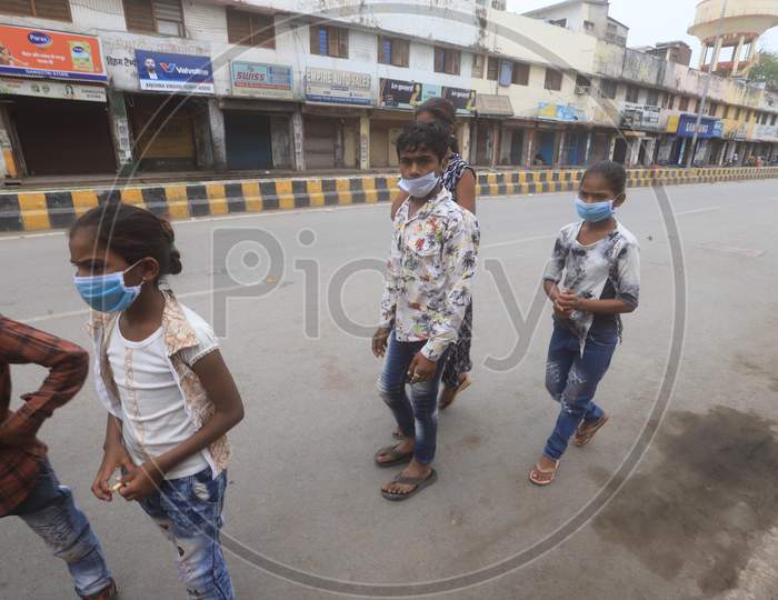 People Wearing Masks And Walking on Roads of Prayagraj Due To Corona Virus Or COVID 19 Outbreak in India