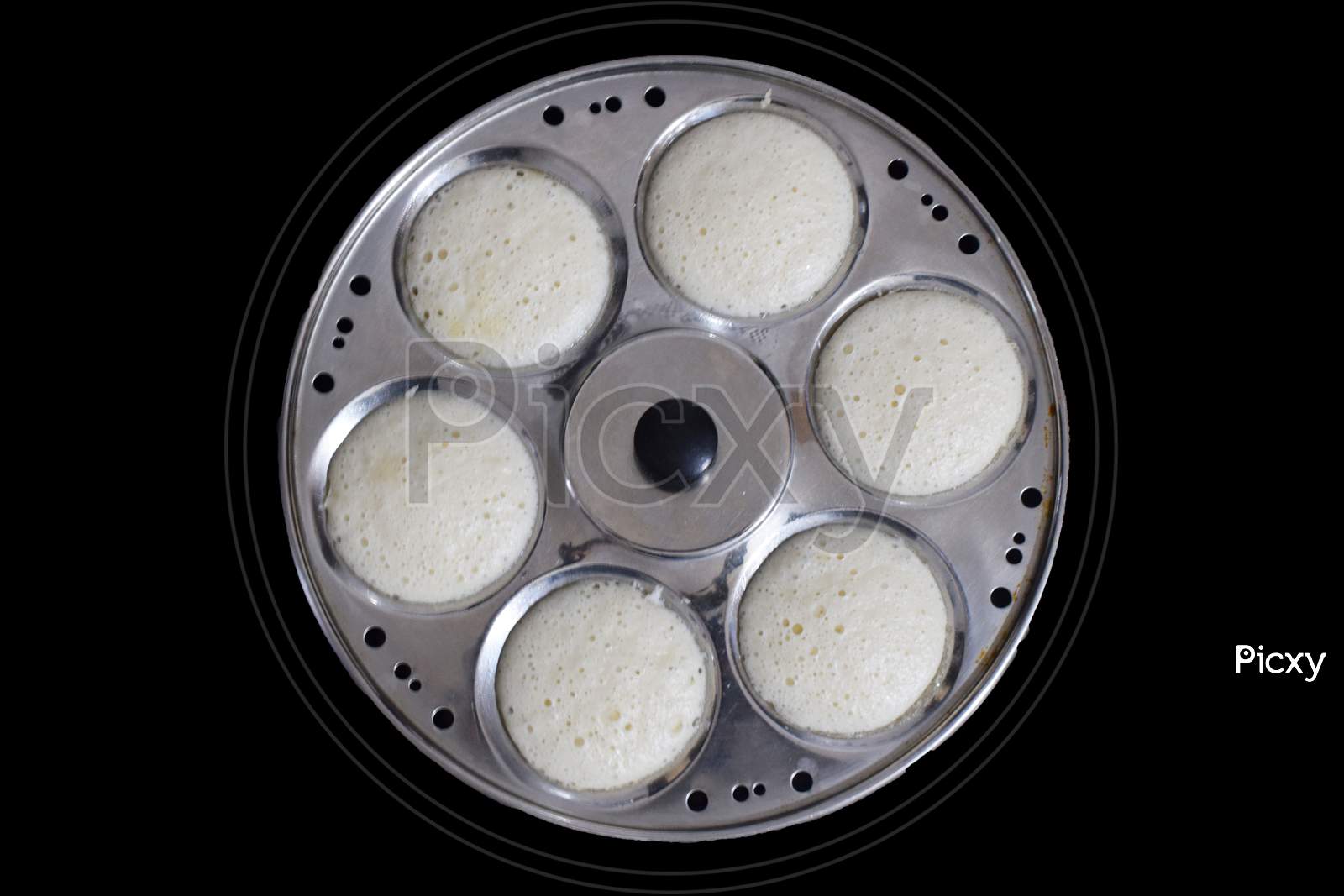Idli in plate with black background top view south indian dish
