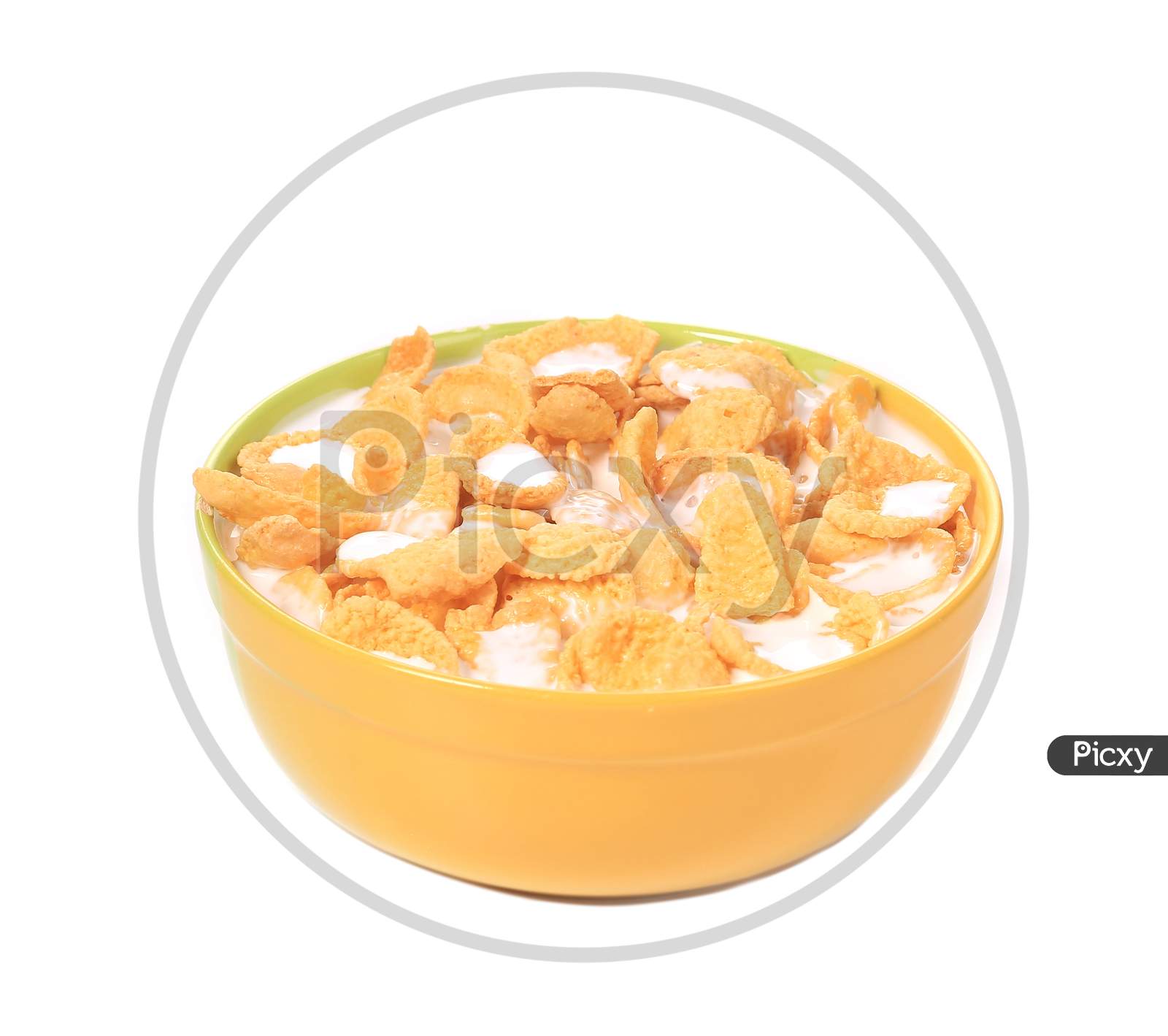 Bowl Of Corn Flakes With Milk Isolated On White Background