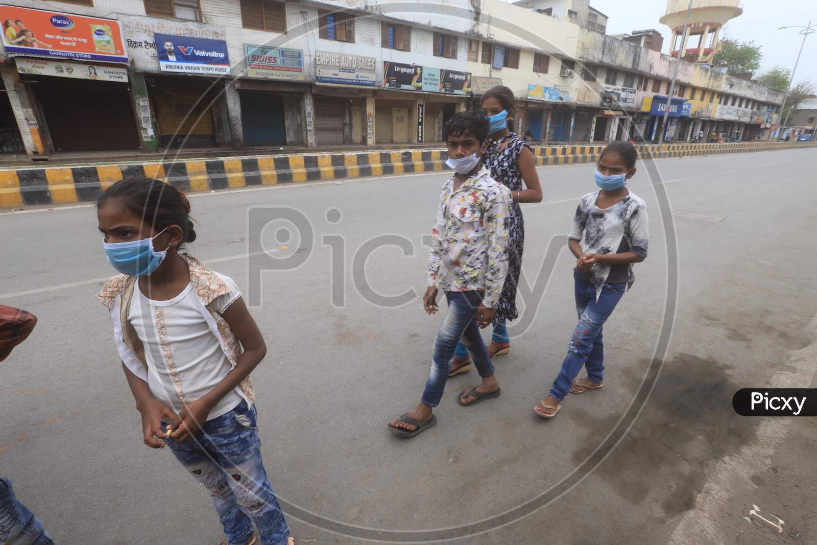 People Wearing Masks And Walking on Roads of Prayagraj Due To Corona Virus Or COVID 19 Outbreak in India