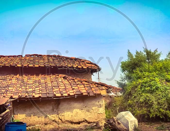 Photo of a village house with open sky