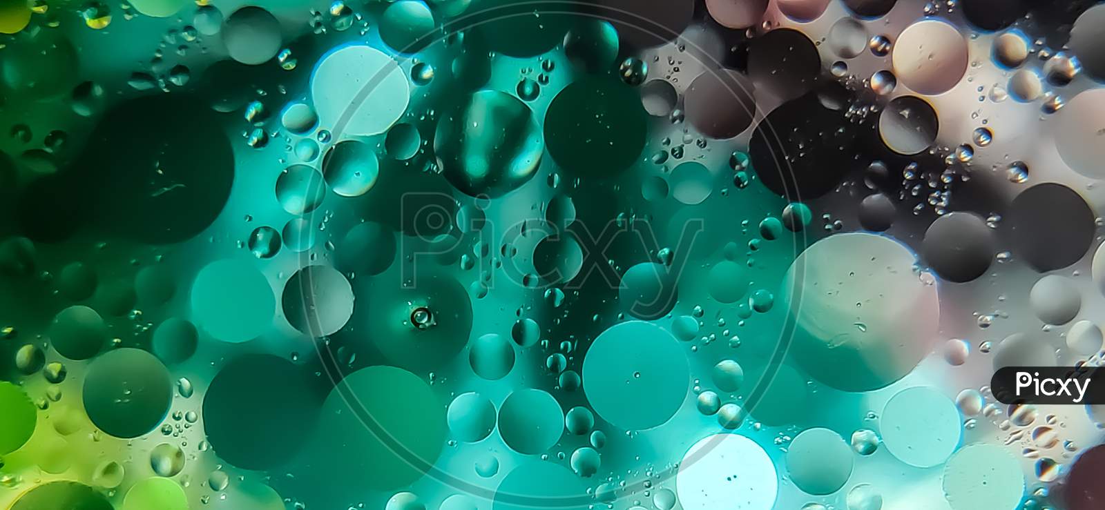Photo of oil drops on water surface