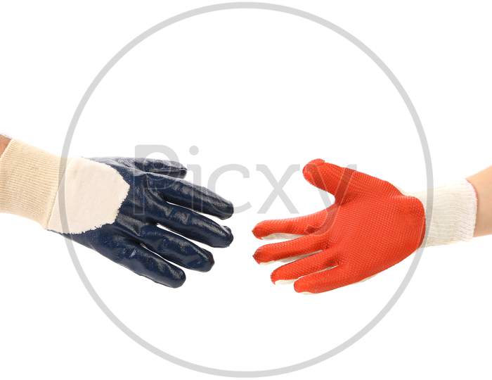 Two Hands In Gloves Meet Of Hand Shake. Isolated On A White Background