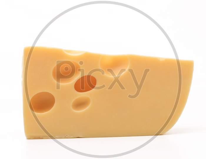 Close Up Of Cheese Slice. Isolated On A White Background