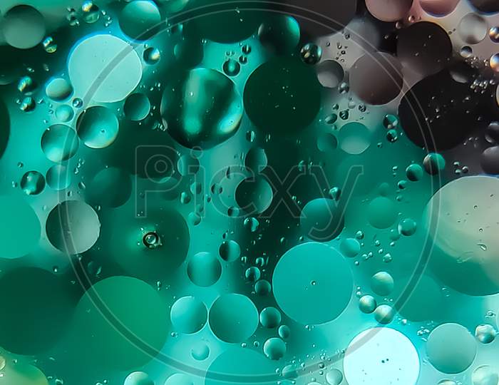 Photo of oil drops on water surface
