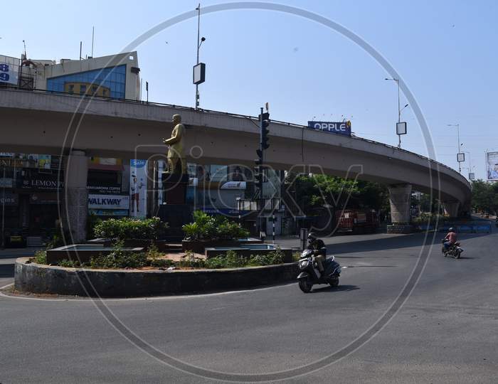 vehicles move on deserted Nagarjunna Circle in Punjagutta, amid nationwide lockdown due to corona virus pandemic outbreak