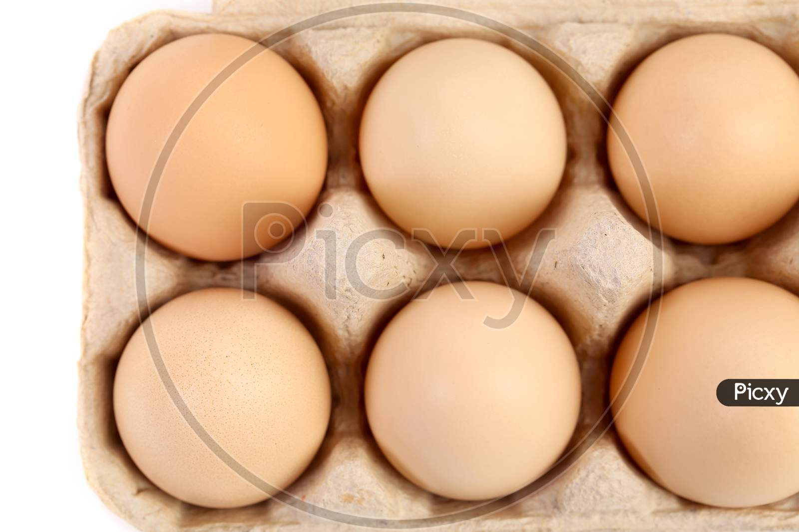 Close Up Of Eggs In Box. Whole Background.