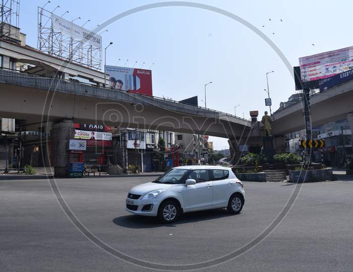 a car moves on deserted Nagarjunna Circle in Punjagutta, amid nationwide lockdown due to corona virus pandemic outbreak