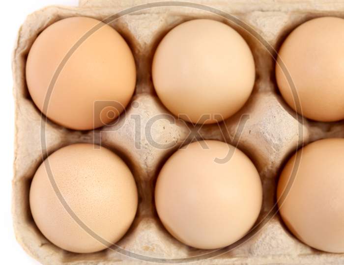 Close Up Of Eggs In Box. Whole Background.