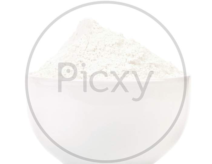 Bowl Of Wheat Flour. Isolated On A White Background.