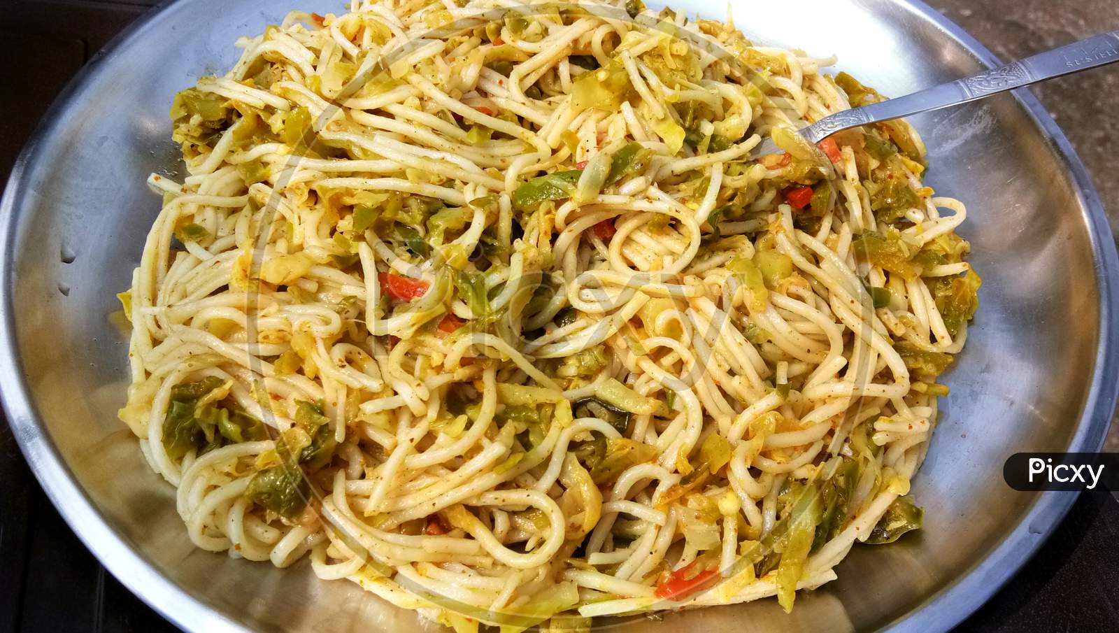 Schezwan Noodles Or Vegetable Hakka Noodles Or Chow Mein Is A Popular Indo-Chinese Recipes, Served In A Bowl Or Plate