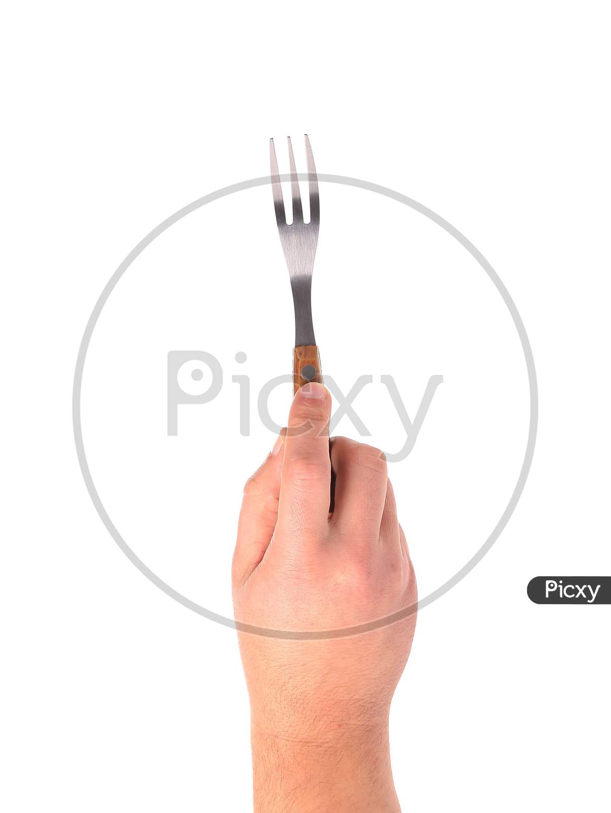 Close Up Of Kitchen Fork In Hand. Isolated On A White Background.