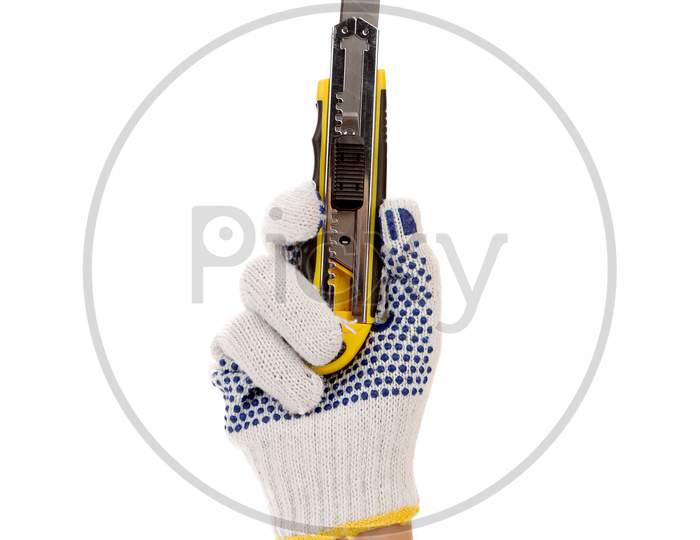 Hand In Gloves Holds Office Knife. Isolated On A White Background.