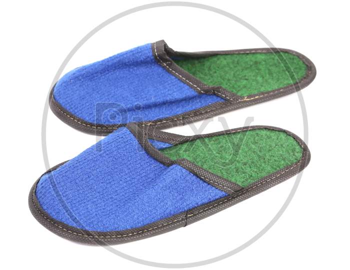 Bright Pair Of Blue Slippers. Isolated On A White Background.