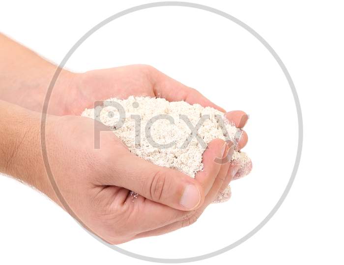 Wheat Flour In Hands. Isolated On A White Background.