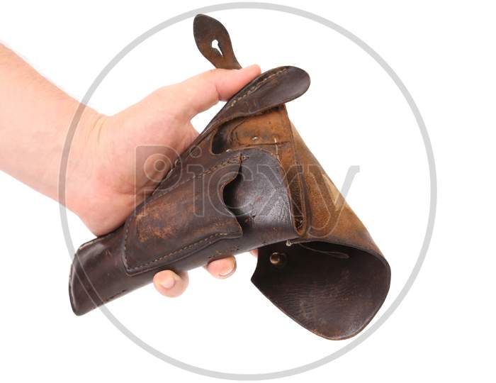 Hand Holds Old Brown Holster. Isolated On A White Background.