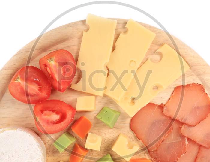 Various Cheese On Wooden Platter. Whole Background.