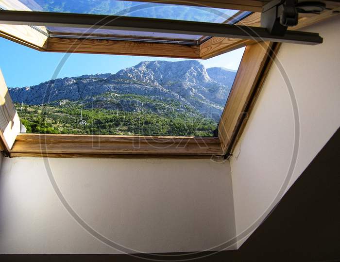 Beautiful view on Biokovo mountains through the window in Croatia.