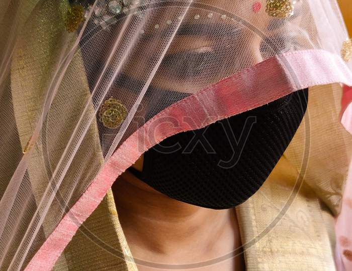 Bride wearing mask