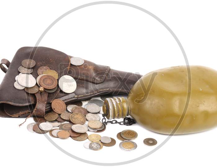 Gun And Flask On Coins. Isolated On A White Background.
