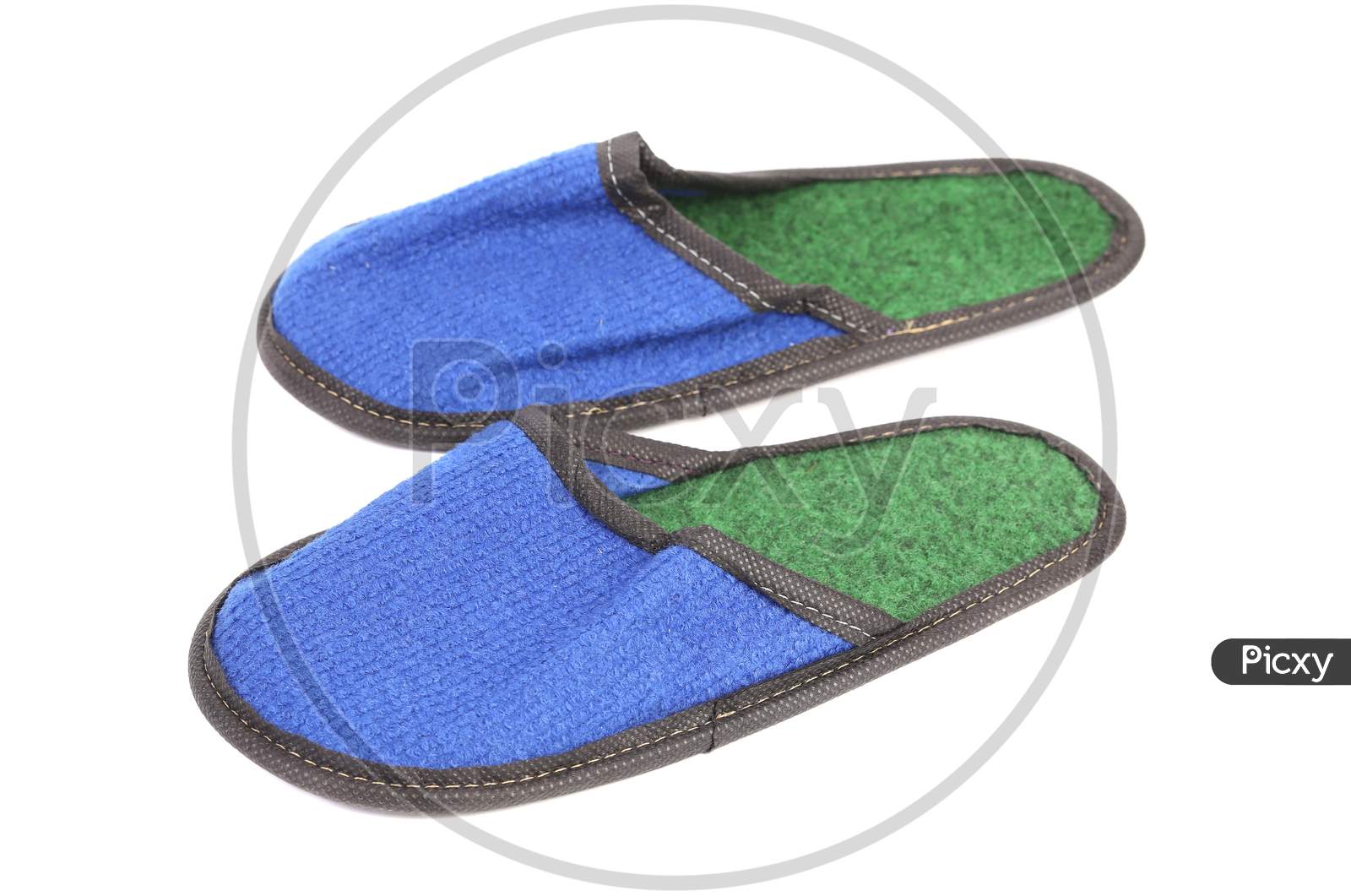 Bright Pair Of Blue Slippers. Isolated On A White Background.
