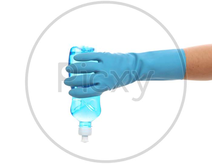 Hand In Glove Holding Blue Plastic Bottle. Isolated On A White Background.
