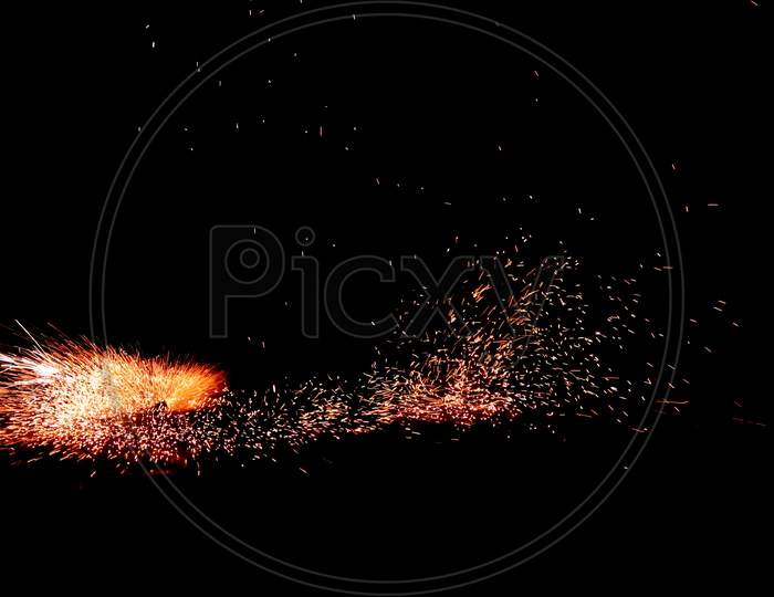A man celebrating diwali with fireworks, Long exposure photography. Have space for text.