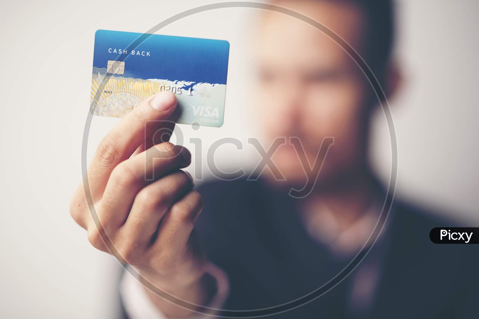 Man Holding a Credit Or Debit Card in Hand Closeup