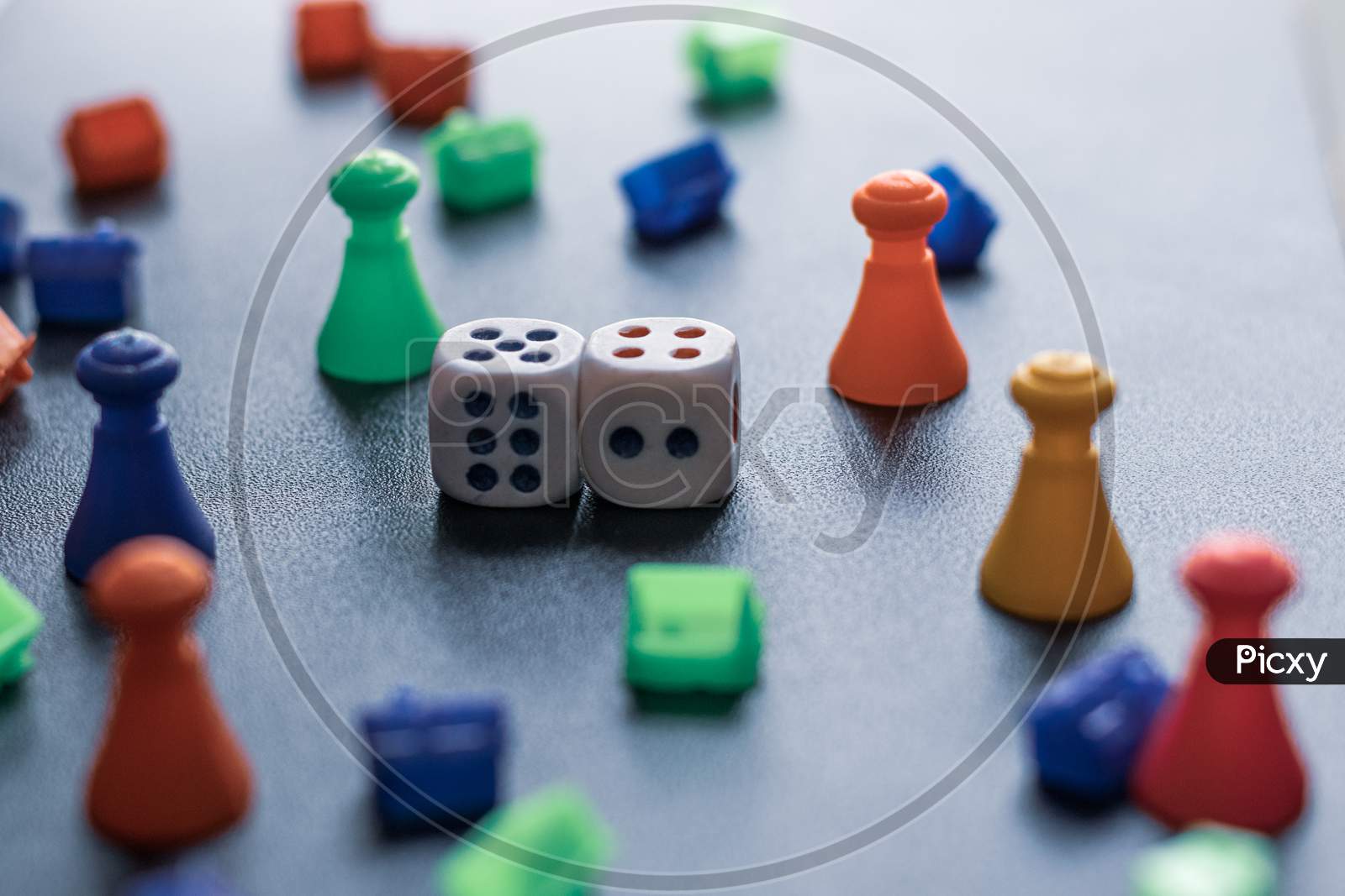 Colorful Plastic game pieces and dice used to play in  game