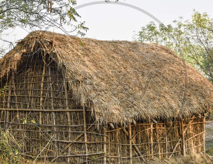 Picture of a hut made of bamboo and clay in a jungle