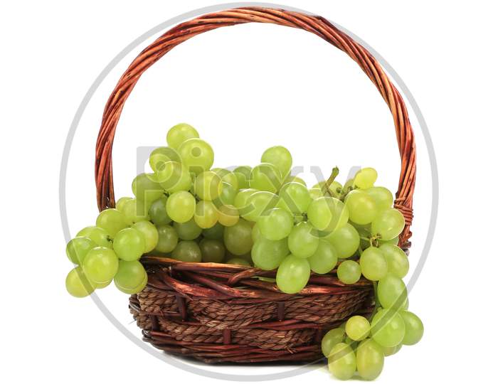 Green Ripe Grapes In Basket. Isolated On A White Backgropund.
