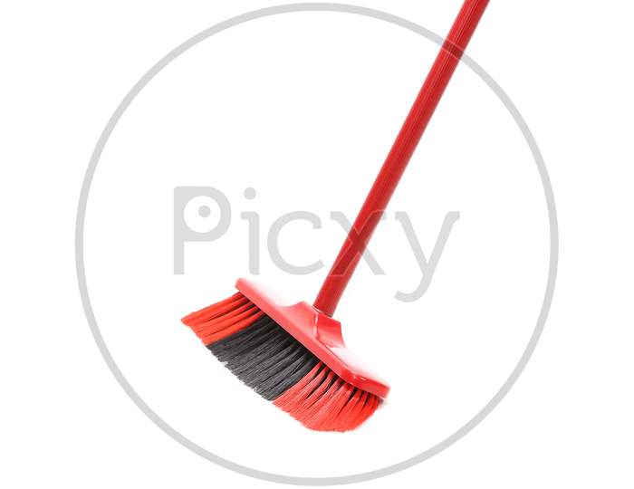 Close Up Of Red Black Broom. Isolated On A White Background.
