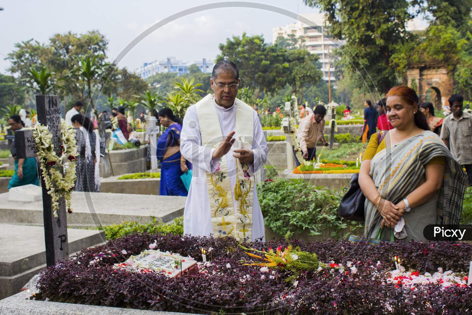 on all souls day, christian people come to cemetery to remember their ancestors as a ritual