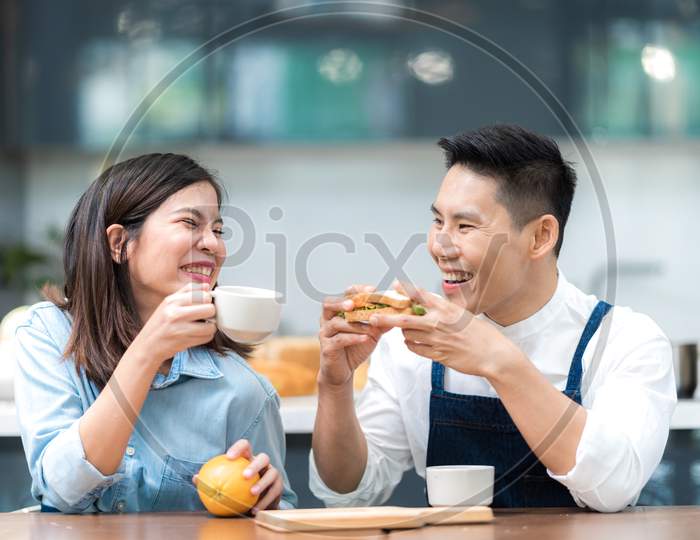 Happy Young Couple Have Breakfast At Home.