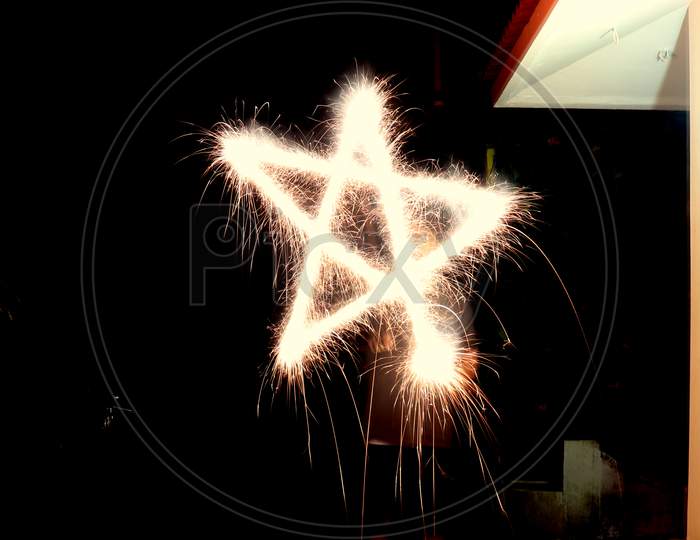 A person celebrating diwali with fireworks, Long exposure photography. Have space for text.