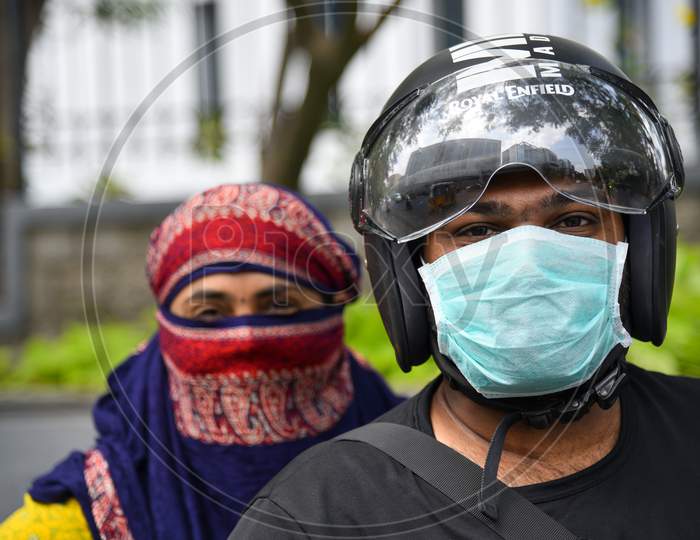 A Couple  Wearing Safety Masks For Corona Virus Or COVID 19 Outbreak in India