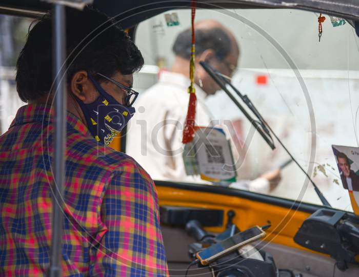 An Auto driver wearing preventive face mask to protect himself from CoVID19, Corona Virus