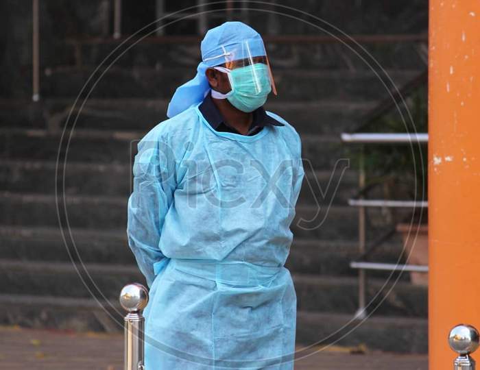 A guard wearing protective masks and apron outside COVID 19 corona virus Isolation Ward