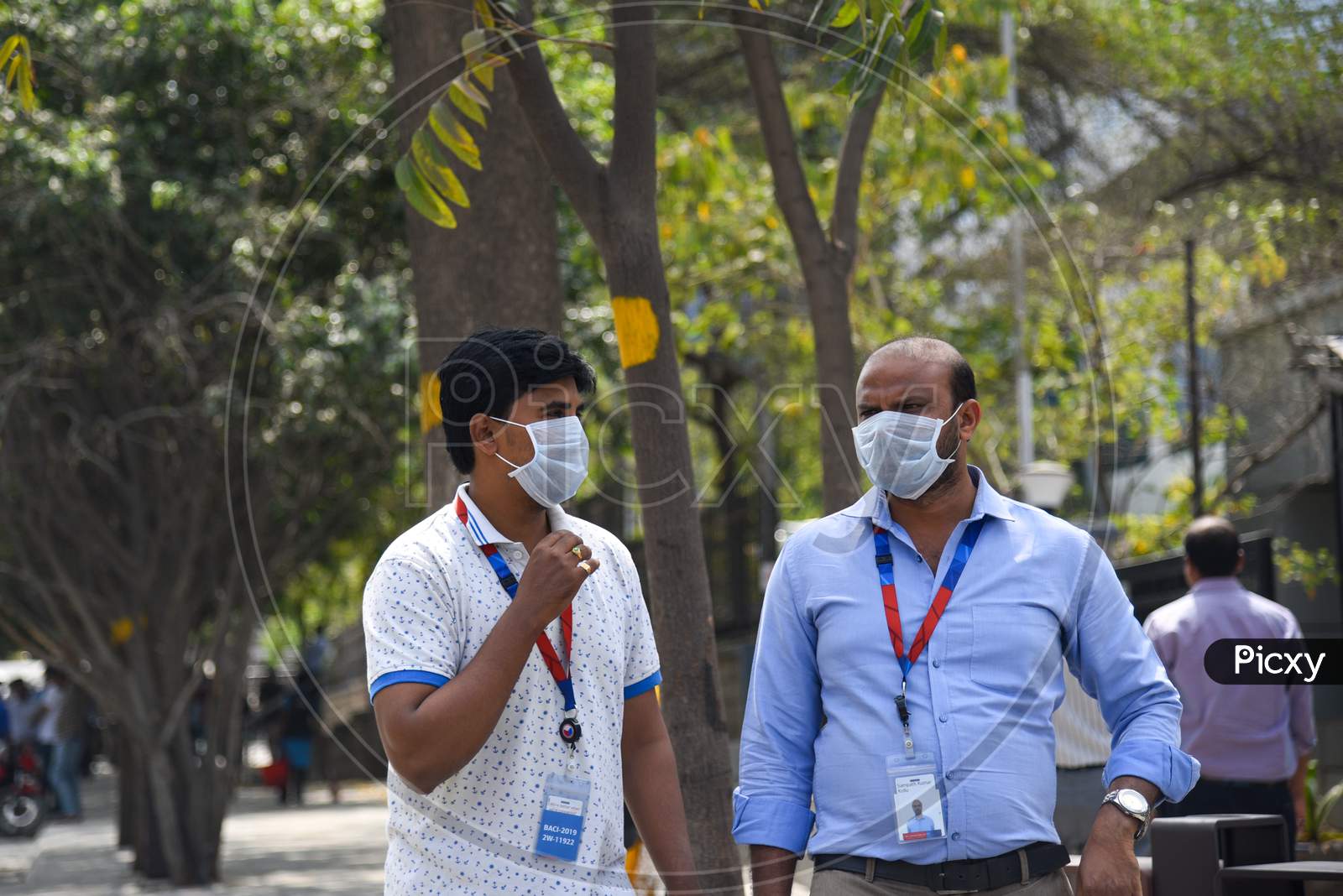 Employees of Raheja Mindspace IT Park wearing preventive face masks to protect themselves from CoVID19, Corona Virus