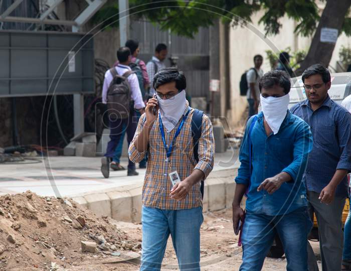 IT Employes use kerchief as a preventive measure from getting infected from CO-VID19, Corona Virus and started to evacuate Raheja Mindspace Campus as they were asked to evacuate the campus