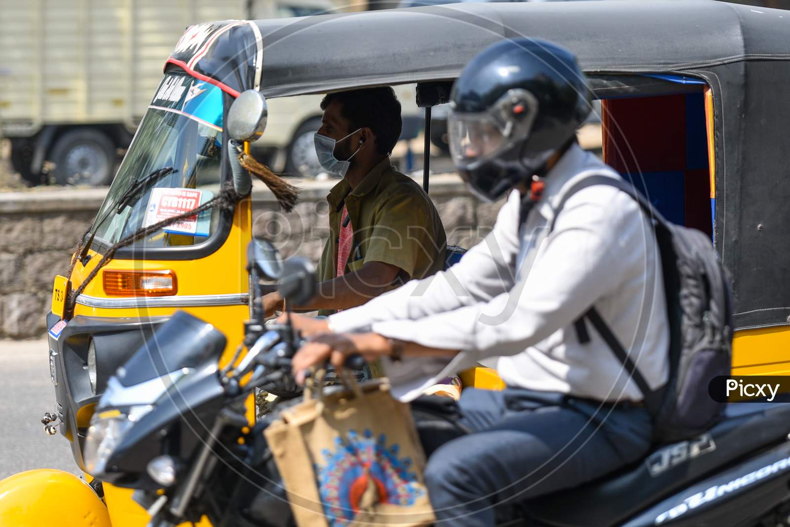 An Auto driver wearing a Face Masks amid Novel Corona Virus Outbreak in Hyderabad, COVID-19