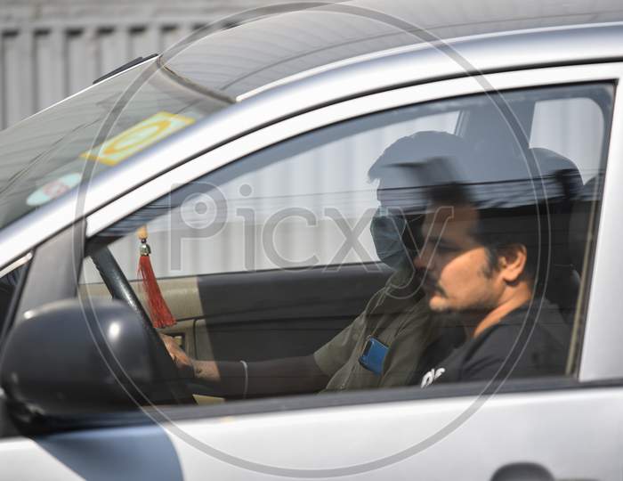 A man drives his car wearing a Face Mask amid Novel Corona Virus Outbreak in Hyderabad, COVID-19