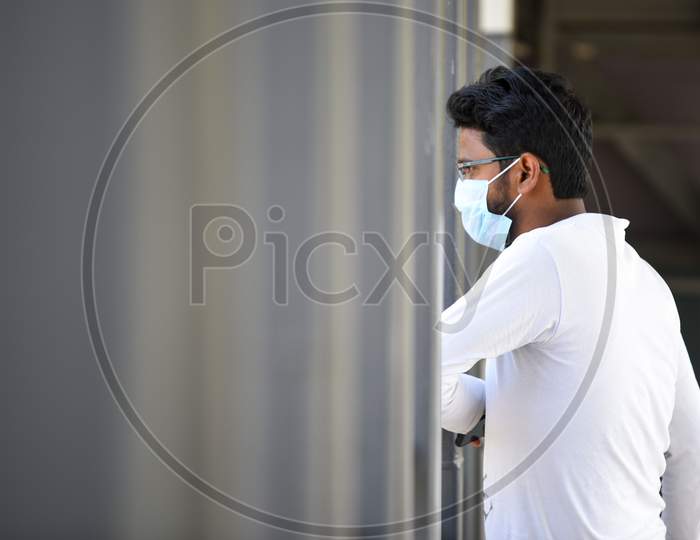 A man wearing the preventive pollution mask on his face to protect himself from Novel Corona Virus, COVID-19