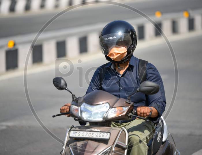 A rider seen wearing Face Mask amid Corona Virus outbreak in Hyderabad
